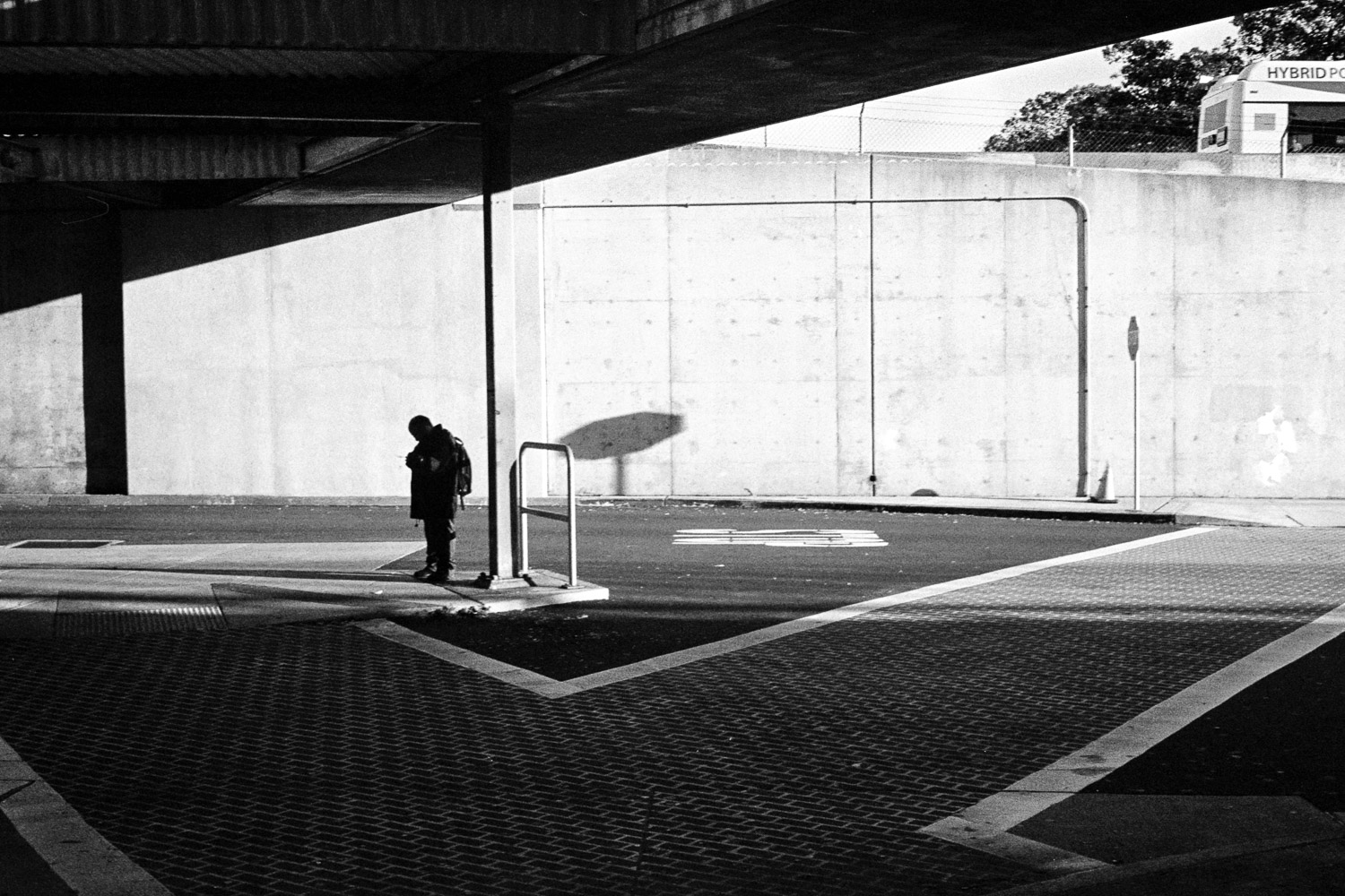 A person waiting at a bus stop