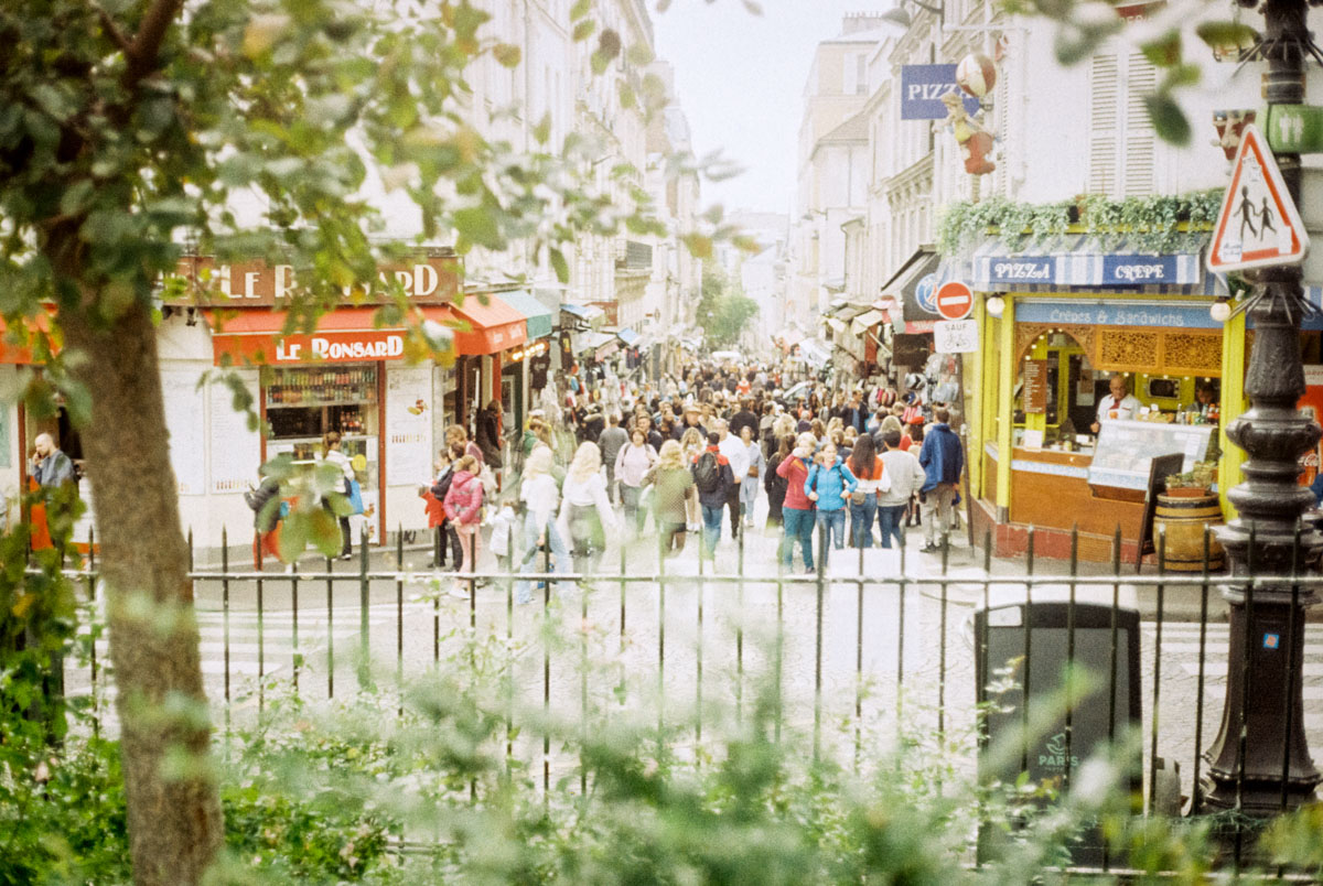 a crowded street in montmartre paris
