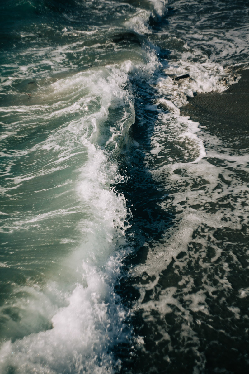 a wave crashing on the surf