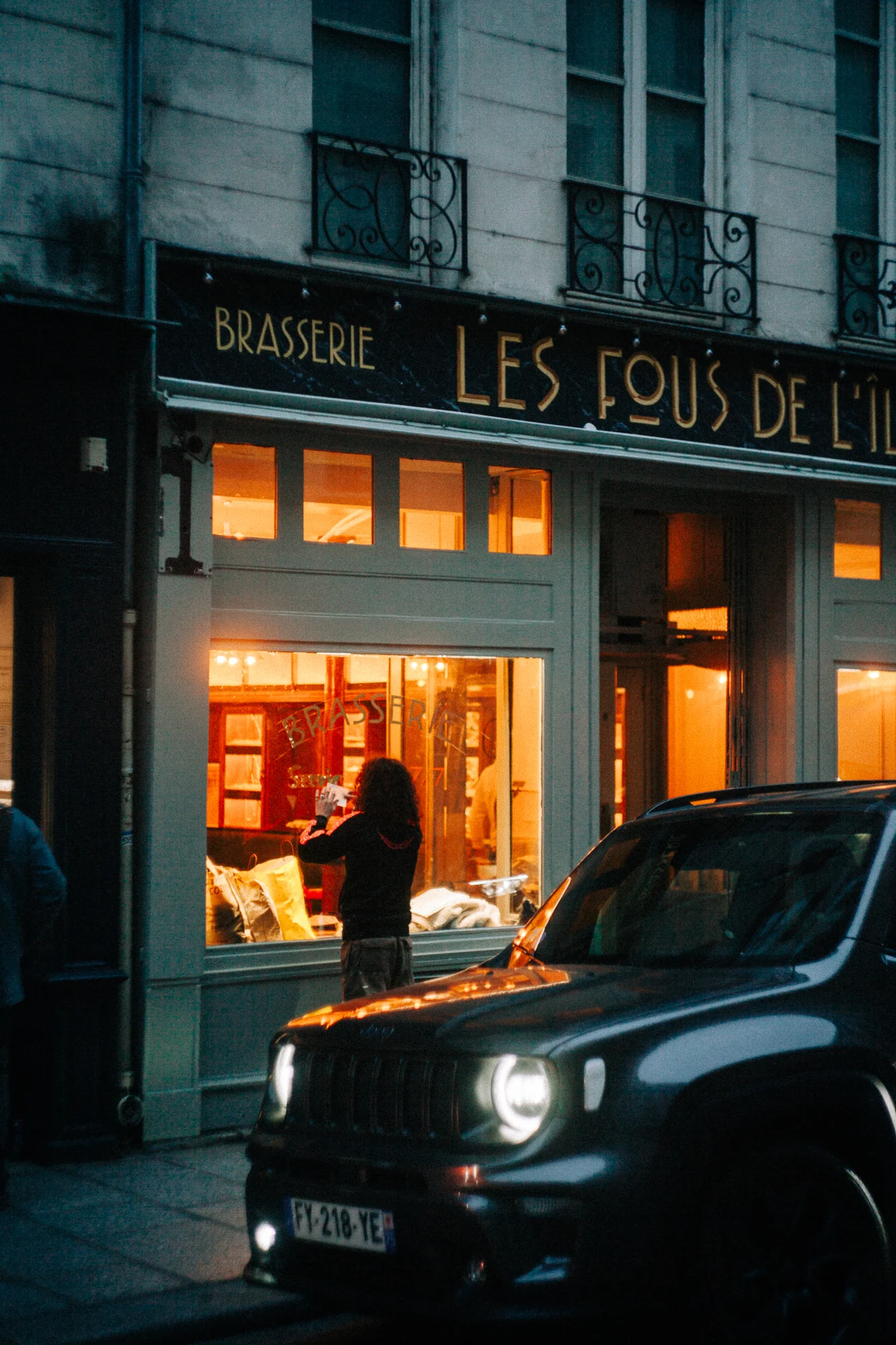 a sign painter working in the evening