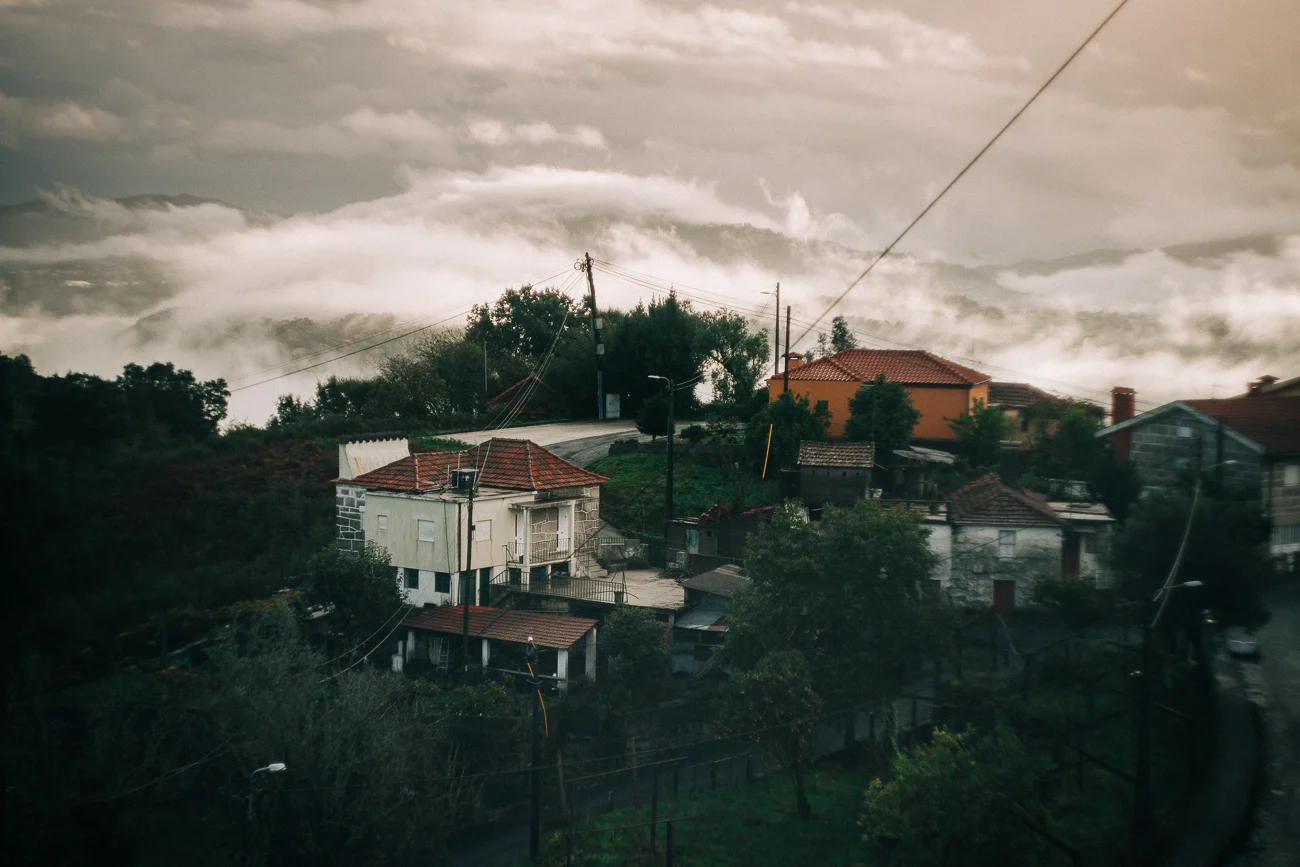 dramatic clouds below a mountain village