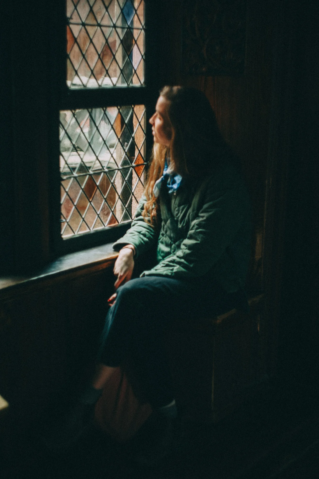 a woman looking out a window