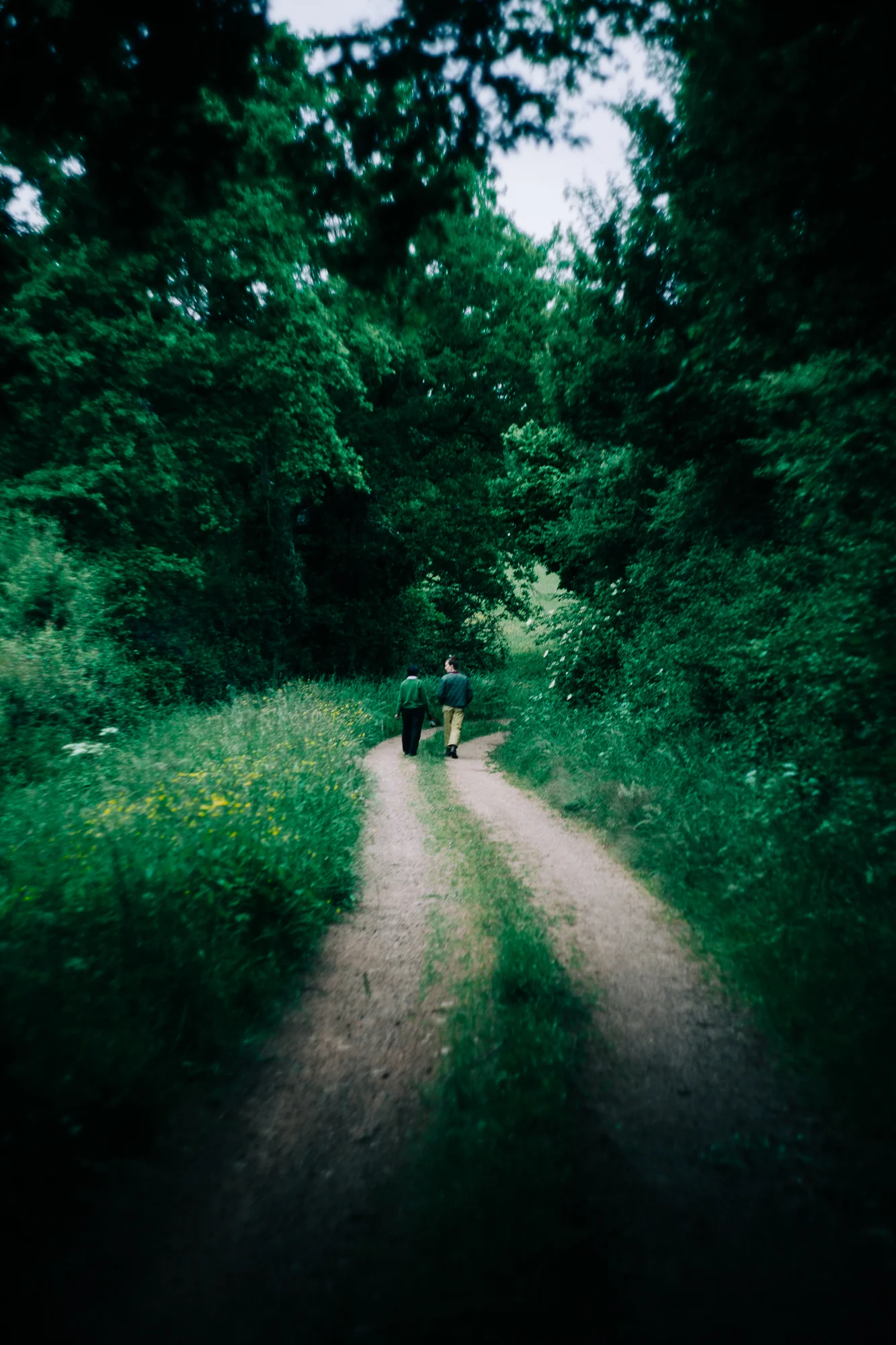 two people on a gravel road