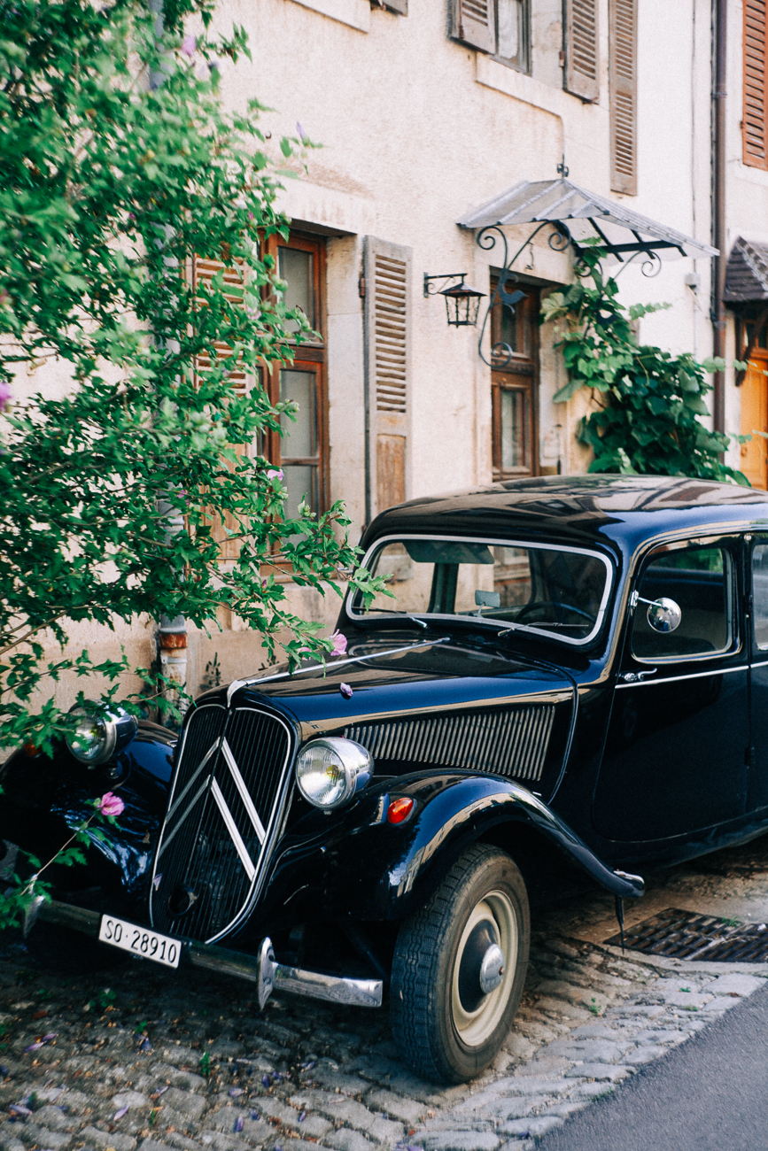 a classic old car in an old village