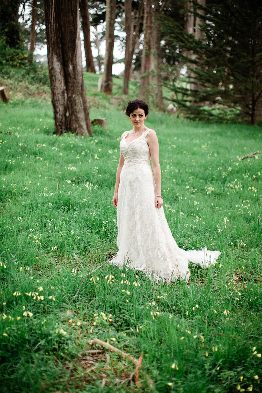 a portrait of a bride on green grass