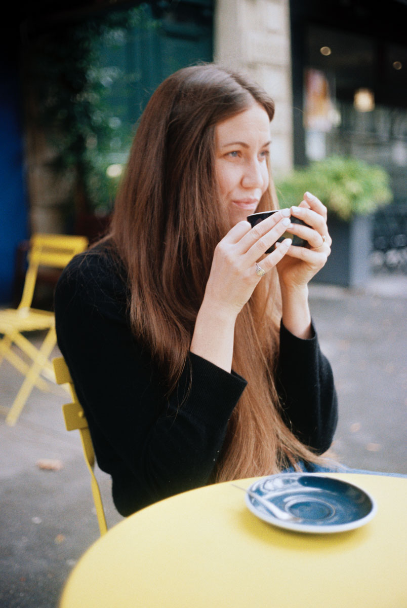 a woman enjoying a cappuccino
