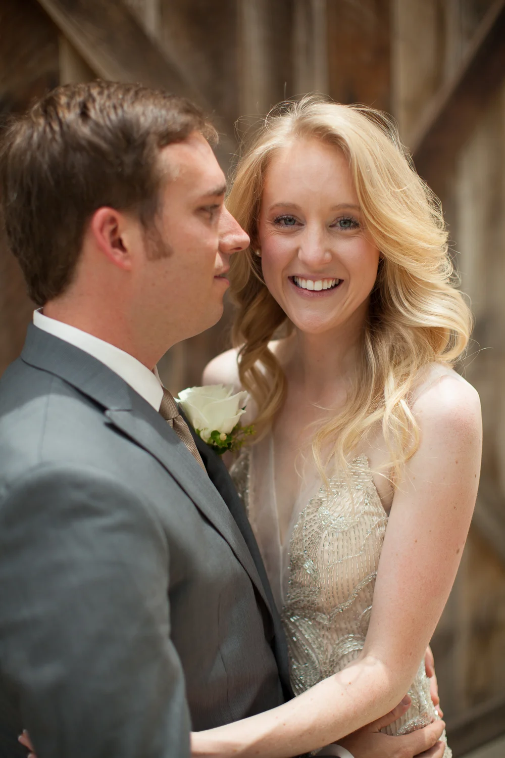 a groom embracing a bride