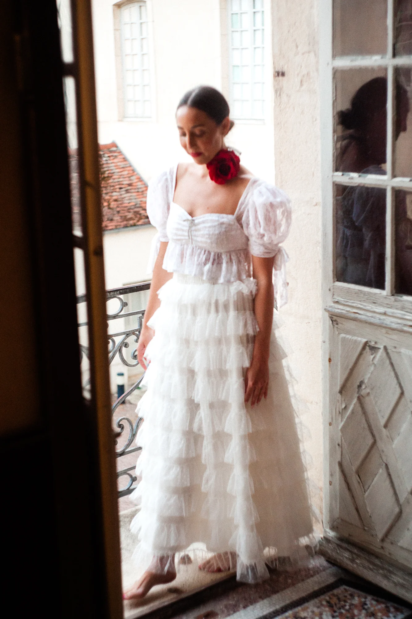 a portrait of a bride out on an upper terrace