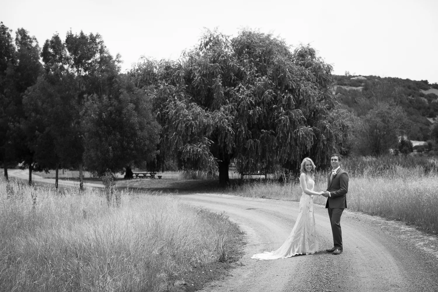 a couple standing in the countryside