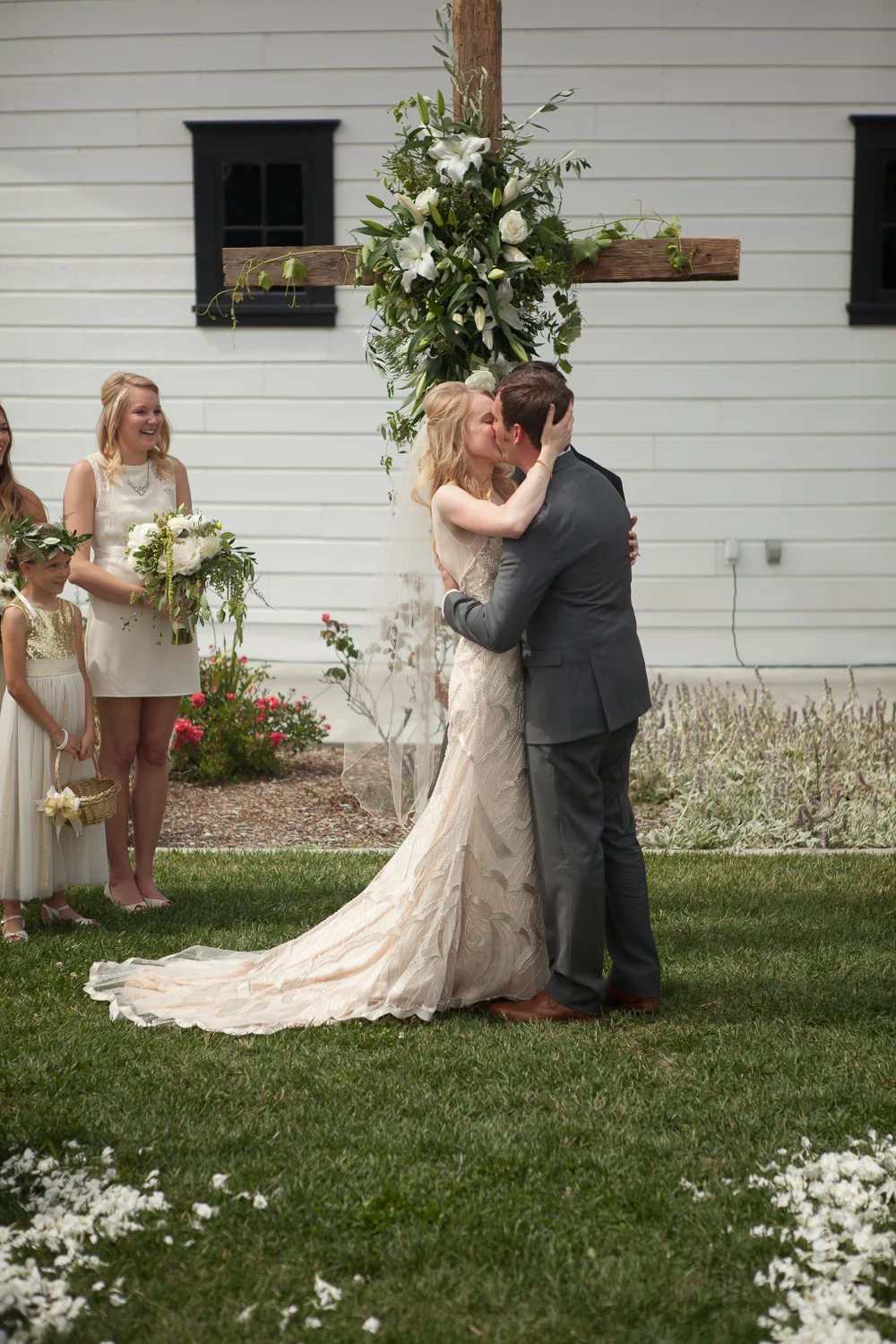 a bride and groom kissing for the first time